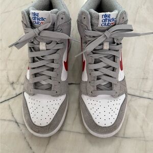 Nike Gray and White dunks with Red Swoosh